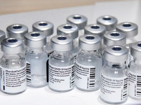 Empty vials of the Pfizer-BioNTech coronavirus vaccine are seen at the Michener Institute, in Toronto, on Jan. 4.