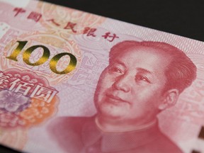 The image of former Chinese leader Mao Zedong is displayed on a 100 yuan banknote.