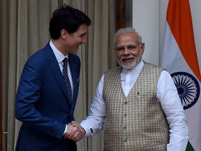 Prime Minister Justin Trudeau, left, and Indian Prime Minister Narendra Modi shake hands before a meeting at Hyderabad house in New Delhi in 2018.