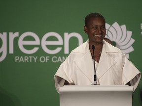 Green party leader Annamie Paul in seen in happy times, at the party leadership announcement in Ottawa on Oct. 3, 2020. The party's federal council has withdrawn funding for her staff and her election campaign and is reviewing her party membership over her moderate stance towards Israel.