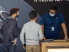 Customers at an Apple store. The company generally requires customers to go to its stores for repairs on its devices.