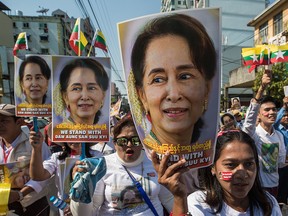 In a file photo from Dec. 10, 2019, supporters of Aung San Suu Kyi rally in Yangon as Suu Kyi prepared to defend Myanmar at the International Court of Justice in The Hague against accusations of genocide against Rohingya Muslims.