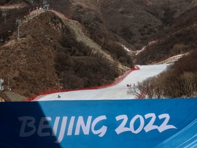 Skiers ski at the National Alpine Ski Centre in Yanqing District, where Beijing 2022 Winter Olympics are scheduled to take place.