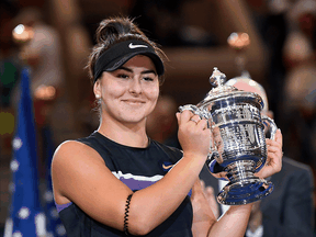 Bianca Andreescu holds up the U.S. Open championship trophy after beating Serena Williams in the women’s singles final in front of a largely hostile crowd at Arthur Ashe Stadium in 2019. The Australian Open next week will be the Canadian tennis player’s first Grand Slam event since then.