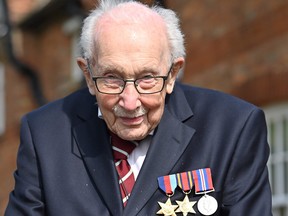 World War II veteran Captain Tom Moore, 99, does a lap of his garden in the village of Marston Moretaine, 50 miles north of London, on April 16, 2020.