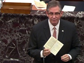Attorney Bruce Castor,  defending Donald Trump, brandishes a copy of the U.S. Constitution as he addresses the U.S. Senate during the second impeachment trial of the former president, in Washington, U.S., February 9, 2021.