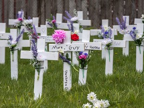 Crosses are seen outside the Camilla Care Community long-term care facility in Mississauga, Ont., where 50 people had died of COVID-19, in a file photo from May 11, 2020.