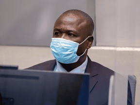 Former Lord's Resistance Army commander Dominic Ongwen sits in the courtroom of the International Criminal Court in The Hague, Netherlands, February 4, 2021.