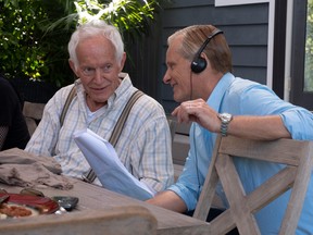 Viggo Mortensen wears his directing hat and headphones with Lance Henriksen on the set of Falling.