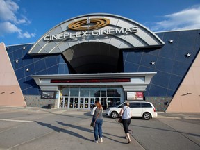People attend a Cineplex movie cinema after indoor dining restaurants, gyms and cinemas re-open under Phase 3 rules from coronavirus disease (COVID-19) restrictions in Toronto, Ontario, July 31, 2020.