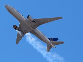 United Airlines flight UA328, carrying 231 passengers and 10 crew on board, returns to Denver International Airport with its starboard engine on fire after it called a Mayday alert, over Denver, Colorado, U.S. February 20, 2021.