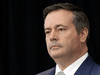 Premier Jason Kenney claims the threat of COVID overwhelming the health system has been sharply curtailed