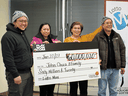 From left, John Chua, Jhoana Chua, Angie Chua and Ben Lagman pick up their cheque at the Western Canada Lottery Corporation offices in Winnipeg after bringing home a staggering $60,000,000 jackpot on the Jan. 22, 2021 Lotto Max draw.