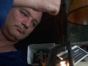 Groundhog Day protagonist Phil Connors takes out his frustration on a vintage alarm clock (Credit: Columbia Pictures).