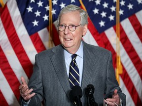 U.S. Senate Minority Leader Mitch McConnell speaks to reporters on Capitol Hill in Washington on Jan. 26.