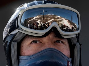The National Alpine Ski Center, where alpine events for the Beijing 2022 Winter Olympics are to be held, is reflected on a skier's goggles in Yanqing district on Feb. 5, 2021, in Beijing, China.