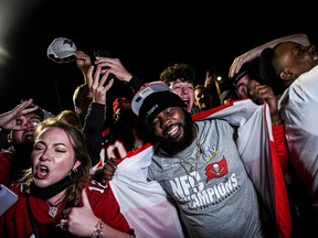 Tampa Bay Buccaneers fans celebrate their victory over the Kansas City Chiefs during Super Bowl LV  in Tampa, Florida on February 7, 2021.