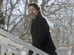 Prime Minister Justin Trudeau walks up the front steps of Rideau Cottage following a news conference in Ottawa,  Friday, January 8, 2021.