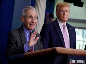 National Institute of Allergy and Infectious Diseases director Dr. Anthony Fauci speaks as U.S. President Donald Trump listens during the coronavirus response daily briefing at the White House in Washington, U.S., April 10, 2020.