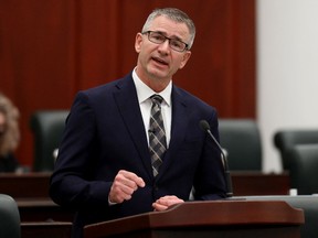 Minister of Finance Travis Toews delivers the 2021 Alberta Provincial budget at the Alberta Legislature, in Edmonton Thursday Feb. 25, 2021.