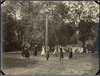 A late 19th century photo of female students playing on a giant stride at Royal Normal College for the Blind in Upper Norwood, England.