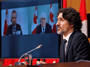 Prime Minister Justin Trudeau with Public Safety Minister Bill Blair, right, and Parliamentary Secretary to the Public Safety Minister Joel Lightbound at a press conference regarding new gun legislation, in Ottawa on Tuesday, Feb. 16, 2021.