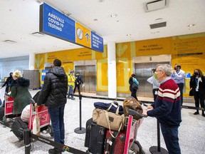 Passengers arrive at Toronto's Pearson airport after mandatory coronavirus disease (COVID-19) testing took effect for international arrivals in Mississauga, Ontario, Canada February 1, 2021.