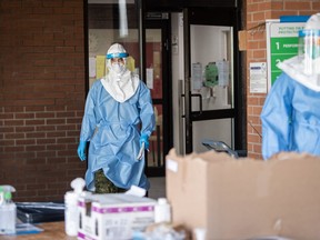 A soldier in PPE exits a Quebec long-term care home during Operation Laser, the Canadian Armed Forces' response to the early stages of COVID-19.