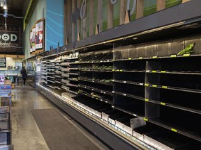 Nearly empty shelves in the produce section at a grocery store in Houston, on Feb. 19.