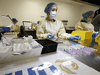 Healthcare technicians prepare syringes of the Pfizer-BioNTech COVID-19 vaccine for front-line healthcare workers in Toronto, January 7, 2021.