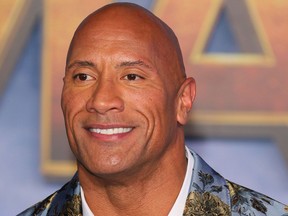 In this file photo taken on December 9, 2019 US actor Dwayne Johnson arrives for the World Premiere of "Jumanji: The Next Level" at the TCL Chinese theatre in Hollywood.