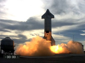 This screengrab made from SpaceX's live webcast shows the Starship SN10 prototype during the second attmpted test flight of the day at SpaceX's South Texas test facility near Boca Chica Village in Brownsville, Texas, March 3, 2021.