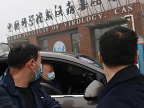 On February 3, 2021, members of the World Health Organization team investigating the origins of the COVID-19 pandemic arrive by car at the Wuhan Institute of Virology in Wuhan in China's central Hubei province.
