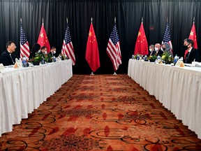 U.S. Secretary of State Antony Blinken, right, speaks while facing Yang Jiechi, director of China's Central Foreign Affairs Commission Office, at the opening session of U.S.-China talks in Anchorage, Alaska, on March 18, 2021.