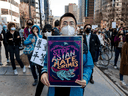 People march in downtown Montreal during a protest against anti-Asian racism on March 21, 2021.