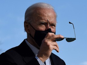 U.S. President Joe Biden prepares to speak to the media on the South Lawn of the White House upon his return from Camp David, on March 21, 2021.