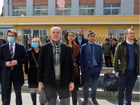 Jim Nickel, charge d'affaires of the Canadian Embassy in China, and other foreign diplomats wwait outside the Intermediate People's Court where Michael Spavor, a Canadian detained by China on suspicion of espionage, stood trial, in Dandong, Liaoning province, China March 19, 2021.