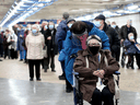 People wait in line in Olympic Stadium for their COVID-19 vaccine as Quebec begins vaccinations for seniors in Montreal, March 1, 2021.