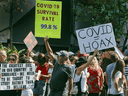People protest COVID-19 safety measures and lockdowns in downtown Toronto on September 26, 2020.