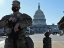 Members of the U.S. National Guard stand watch in front of the U.S. Capitol Building amid heightened security, in Washington, March 3, 2021.