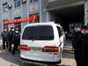 A police vehicle believed to be carrying Michael Spavor, a Canadian detained by China on espionage charges, arrives at Intermediate People’s Court, where he is expected to stand trial, in Dandong, China, March 19, 2021.