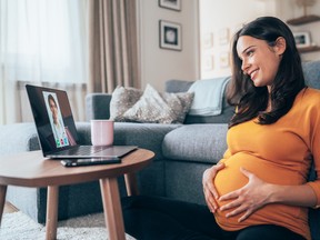 Pregnant woman having Video call with doctor