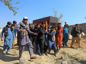 Afghan men carry the coffin of one of three female media workers who were shot and killed by unknown gunmen, in Jalalabad, Afghanistan, on March 3, 2021. The Taliban has embarked upon a campaign of targeted assassinations that has left hundreds of people dead, mostly judges, journalists, women’s rights leaders and civil society figures, writes Terry Glavin.