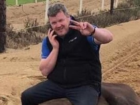 Trainer Gordon Elliott confirmed that a photo showing him sitting on a dead horse is authentic.