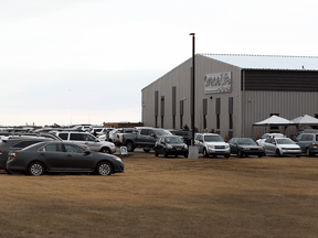 Cars parked outside Gracelife Church near Edmonton on Sunday, March 28, 2021 as Pastor James Coates returns after spending 33 days in jail for disobeying public health orders.