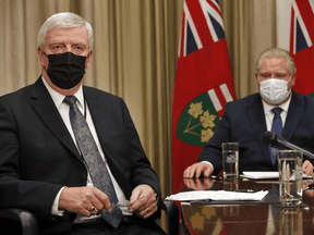 Retired General Rick Hillier and Ontario Premier Doug Ford at Queens Park on Friday February 26, 2021.