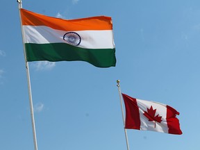 The flags of India and Canada fly during India Day celebrations in Fort McMurray on Aug. 19, 2018. Canada needs to decrease its dependence on trade with China and expand its ties with India, writes Erin O'Toole.