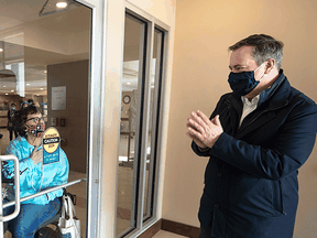 Alberta Premier Jason Kenney during a visit to a Calgary retirement home in early March. Kenney recently said he's "been clear with our health officials here that people must have a choice" on which COVID-19 vaccine they receive.