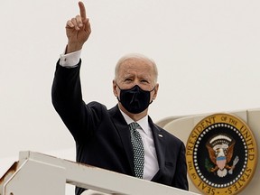 U.S. President Joe Biden, shown returning to Washington from Delaware on March 17, 2021, wants to ensure that every American who wants to can get a vaccine before sharing the U.S. supply.