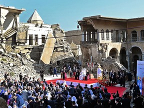 Pope Francis speaks at a square near the ruins of the Syriac Catholic Church of the Immaculate Conception, in northern Mosul on March 7, 2021, during his historic visit to Iraq.